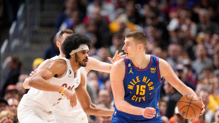 Denver Nuggets Center's Nikola Jokic, 15, and Cleveland Cavaliers Center's Jarrett Allen, 31, were in the first half of Friday's NBA basketball game. 