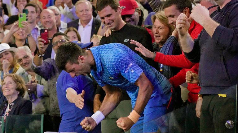 Novak Djokovic of Serbia celebrates with his support team after defeating Stefanos Tsitsipas of Greece in the men's singles final at the Australian Open tennis championship in Melbourne, Australia, Sunday, Jan. 29, 2023. (AP Photo/Aaron Favila)