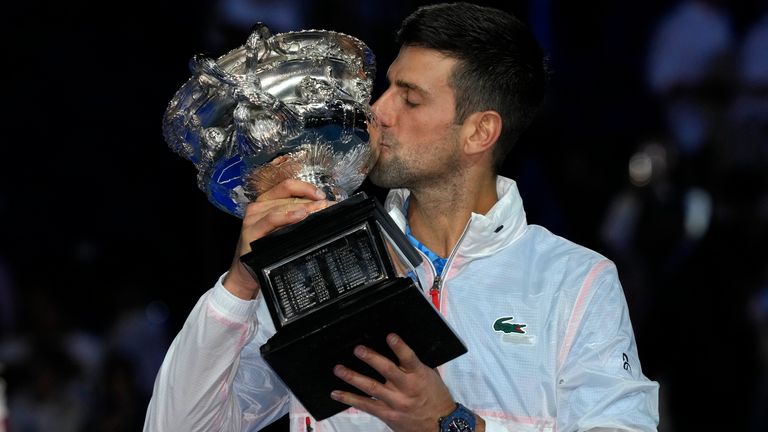 Novak Djokovic of Serbia kisses the Norman Brookes Challenge Cup, after defeating Stefanos Tsitsipas of Greece in the men&#39;s singles final at the Australian Open tennis championship in Melbourne, Australia, Sunday, Jan. 29, 2023.(AP Photo/Dita Alangkara)