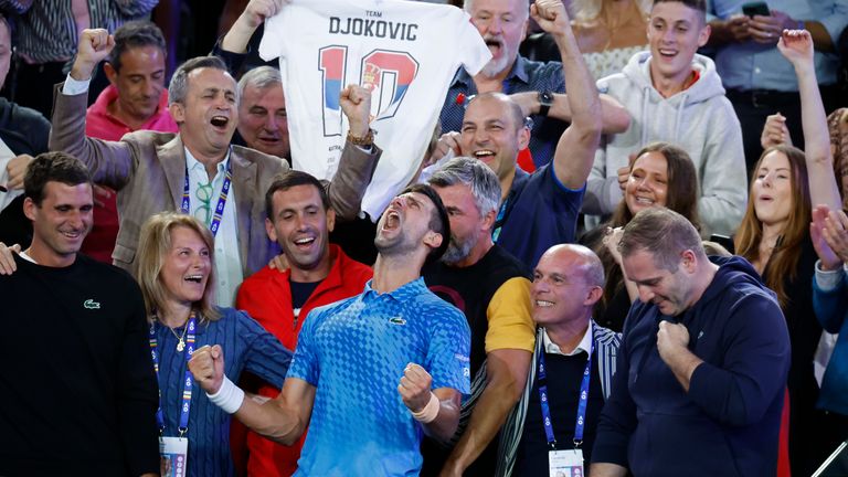 Novak Djokovic of Serbia, center, celebrates with his team including his mother, Dijana, second left, after defeating Stefanos Tsitsipas of Greece in the men&#39;s singles final at the Australian Open tennis championships in Melbourne, Australia, Sunday, Jan. 29, 2023. (AP Photo/Asanka Brendon Ratnayake)