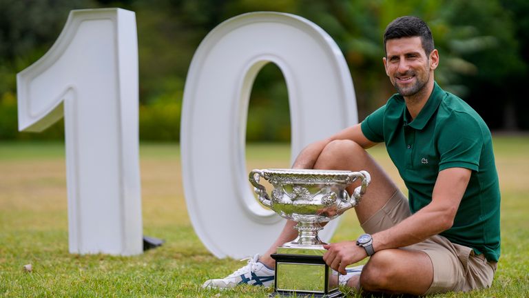 Novak Djokovic of Serbia poses with the Norman Brookes Challenge Cup in the gardens of Government House the morning after defeating Stefanos Tsitsipas of Greece in the men's singles final at the Australian Open tennis championship in Melbourne, Australia, Monday, Jan. 30, 2023. Djokovic has now won ten Australian Open titles. (AP Photo/Ng Han Guan)