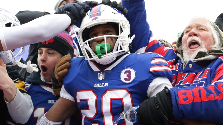 Buffalo Bills running back Nyheim Hines (20) celebrates with fans after scoring a touchdown on a kick return during the first half of and NFL football game against the New England Patriots on Sunday, Jan. 8, 2023, in Orchard Park, N.Y. (AP Photo/Joshua Bessex)