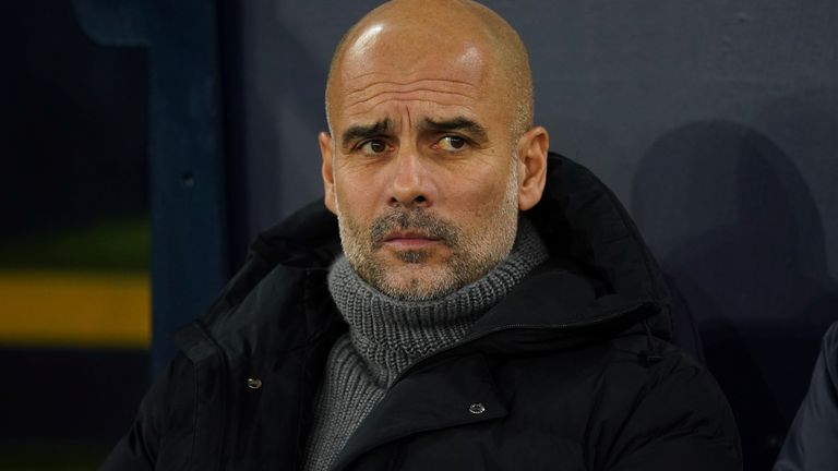 Manchester City head coach Pep Guardiola looks on during the English FA Cup soccer match between Manchester City and Chelsea at the Etihad Stadium in Manchester, England, Sunday, Jan. 8, 2023. (AP Photo/Dave Thompson)