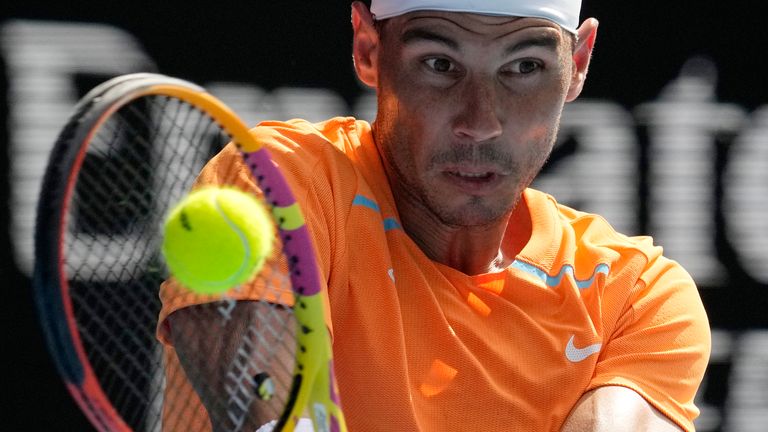Rafael Nadal of Spain plays a backhand return to Jack Draper of Britain during their first round match at the Australian Open tennis championship in Melbourne, Australia, Monday, Jan. 16, 2023. (AP Photo/Aaron Favila)
