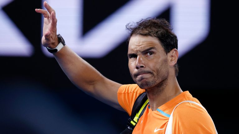 Rafael Nadal of Spain waves as he leaves Rod Laver Arena following his second round loss to Mackenzie McDonald of the U.S. at the Australian Open tennis championship in Melbourne, Australia, Wednesday, Jan. 18, 2023. (AP Photo/Asanka Brendon Ratnayake)