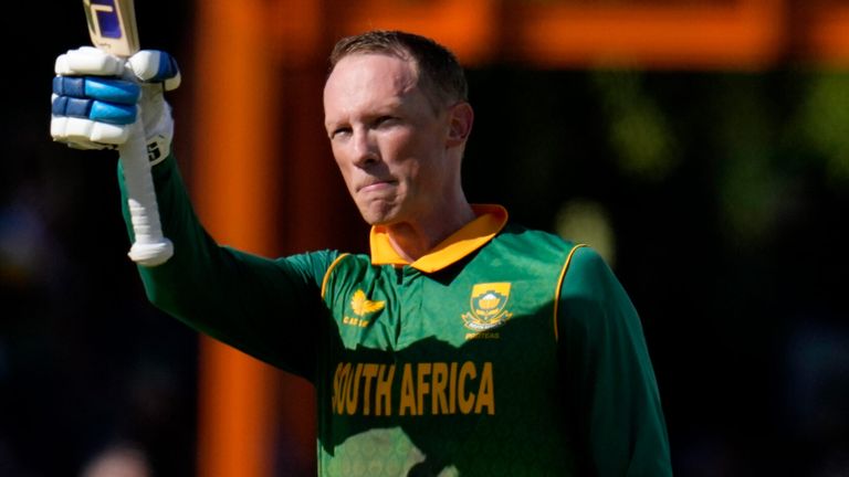 Rassie van der Dussen raises his bat after reaching his century against England