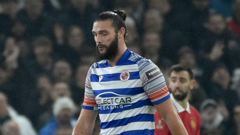 Reading&#39;s Andy Carroll walks off the pitch after being sent off for a second bookable offence during the FA Cup fourth-round match against Manchester United 