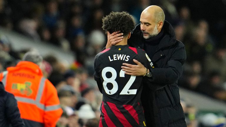 Pep Guardiola greets Lewis after victory over Leeds