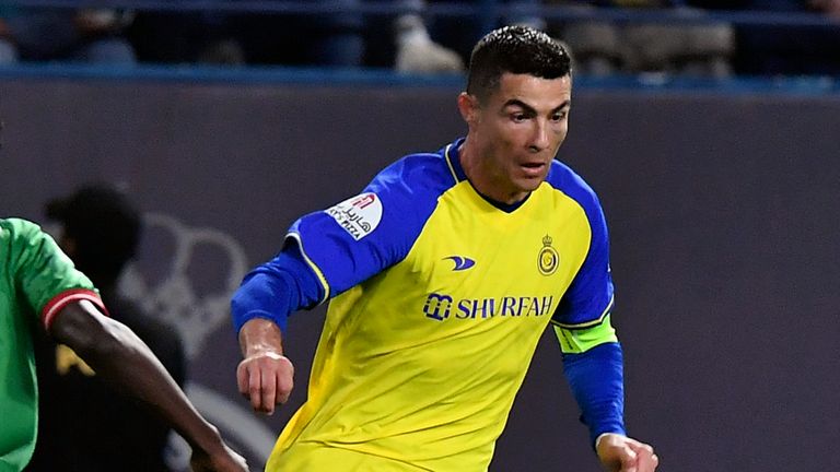 Al Nassr's Cristiano Ronaldo, right, fights for the ball against Al Ettifaq's Abdallah Khateeb