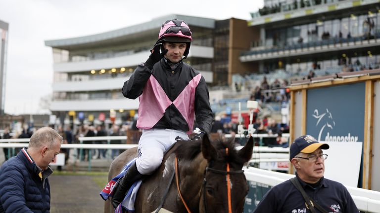 Sam Coltherd salutes the crowd as he returns following victory in the Sky Bet Chase