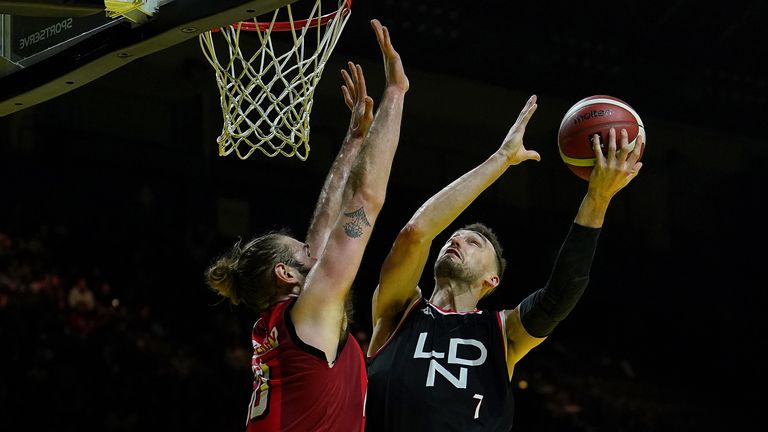 London Lions' Sam Dekker scores past Leicester Riders' Darien Nelson-Henry during the British Basketball Cup Final match at the Utilita Arena Birmingham. Picture date: Sunday January 29, 2023.