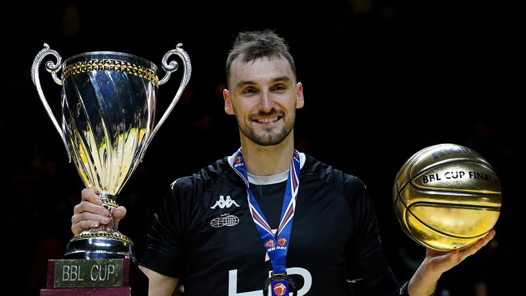 London Lions' Sam Dekker celebrates with the trophy and the man of match trophy after winning the British Basketball Cup Final match at the Utilita Arena Birmingham