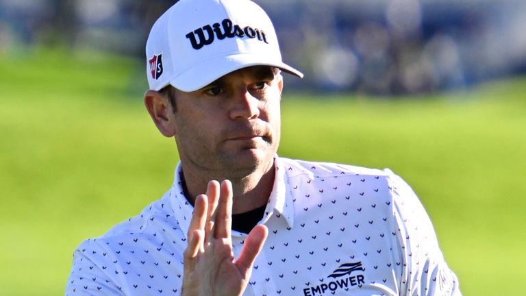 Sam Ryder acknowledges the gallery after finishing his round on the 18th hole of the South Course at Torrey Pines during the second round of the Farmers Insurance Open golf tournament, Thursday, Jan. 26, 2023, in San Diego. (AP Photo/Denis Poroy)