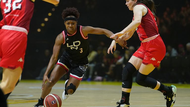 London Lions' Shanice Beckford-Norton drives to the basket past Leicester Riders' Hannah Robb (right), during the Women's British Basketball Cup final 