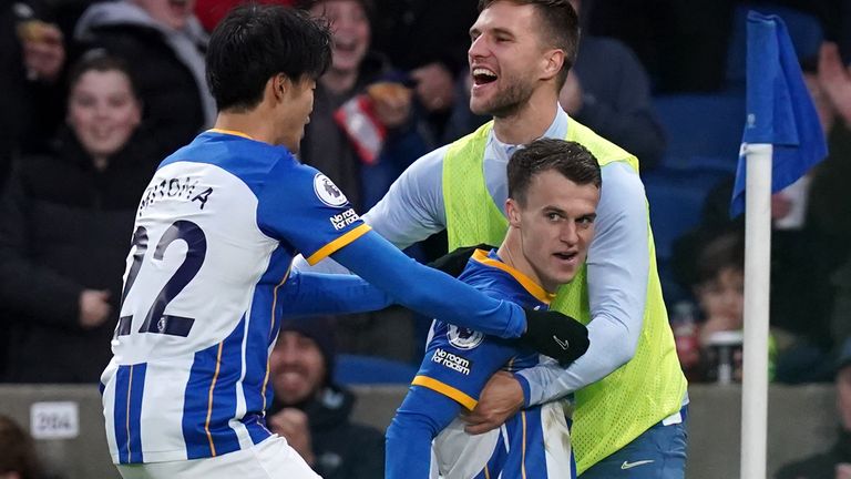 Solly March celebrates his goal against Liverpool
