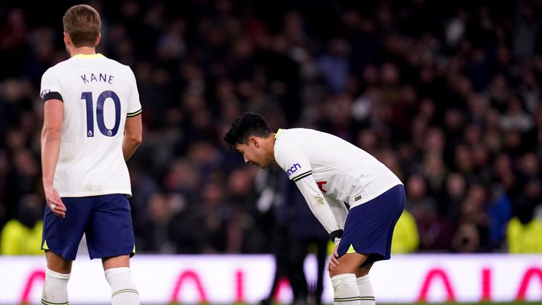 Son Heung-min looks devastated as Harry Kane walks past him after Tottenham's loss to Aston Villa