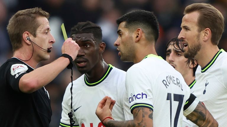 Spurs players confront the referee during their loss to Aston Villa