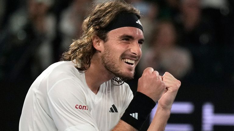 Stefanos Tsitsipas of Greece celebrates after defeating Jannik Sinner of Italy during their fourth round match at the Australian Open tennis championship in Melbourne, Australia, Sunday, Jan. 22, 2023. (AP Photo/Ng Han Guan)