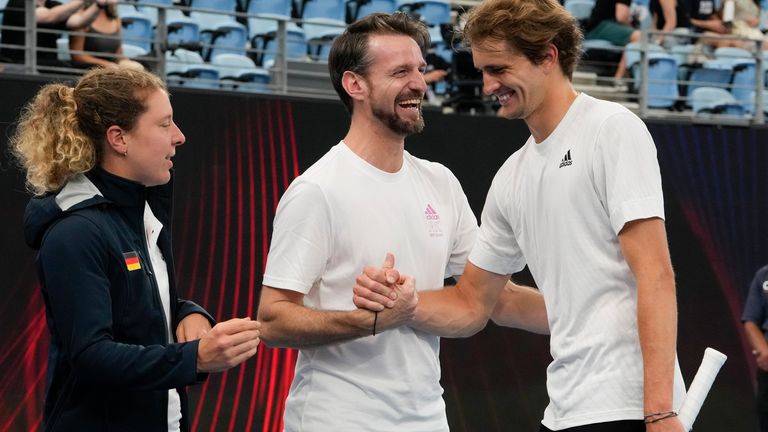 Germany&#39;s Alexander Zverev, right, is congratulated by teammates after he and partner and Laura Siegemund defeated Marie Bouzkova and Jiri Lehecka of the Czech Republic in their Group C mixed doubles match at the United Cup tennis event in Sydney, Australia, Sunday, Jan. 1, 2023. (AP Photo/Mark Baker)