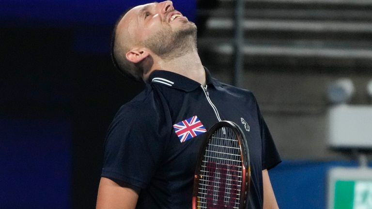 Britain&#39;s Daniel Evans celebrates after defeating Spain&#39;s Albert Ramos-Vinolas in their Group D match at the United Cup tennis event in Sydney, Australia, Sunday, Jan. 1, 2023. (AP Photo/Mark Baker)