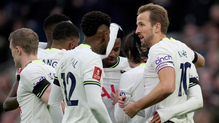 Harry Kane is mobbed by his team-mates after opening the scoring for Spurs against Portsmouth