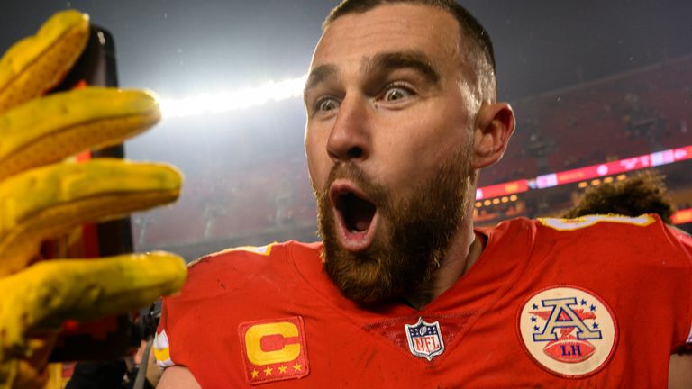 Kansas City Chiefs tight end Travis Kelce does a social media post after their win over the Jacksonville Jaguars in an NFL divisional round playoff football game, Saturday, Jan. 21, 2023 in Kansas City, Mo. (AP Photo/Reed Hoffmann)