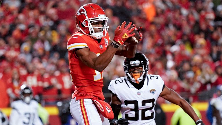 Kansas City Chiefs wide receiver Marquez Valdes-Scantling (11) makes a touchdown catch against Jacksonville Jaguars cornerback Tyson Campbell (32) during the second half of an NFL divisional round playoff football game, Saturday, Jan. 21, 2023, in Kansas City, Mo. (AP Photo/Charlie Riedel)