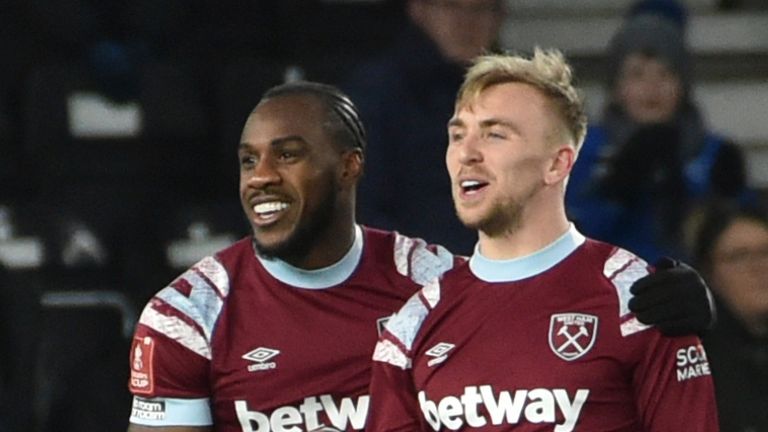 West Ham's Michail Antonio, left, celebrates after scoring his side's second goal during the English FA Cup 4th round soccer match between Derby County and West Ham at Pride Park stadium in Derby, England, Monday, Jan. 30, 2023. (AP Photo/Rui Vieira)