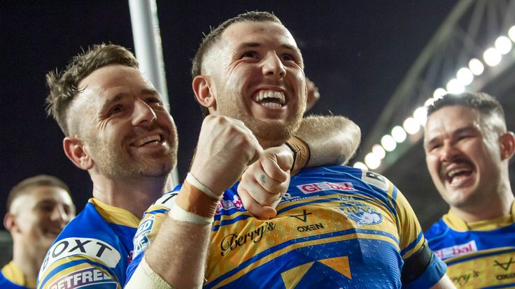 Picture by Allan McKenzie/SWpix.com - 16/09/2022 - Rugby League - Betfred Super League Semi Final - Wigan Warriors v Leeds Rhinos - DW Stadium, Wigan, England - Leeds's Richie Myler & Cameron Smith celebrate to their fans after victory over Wigan.