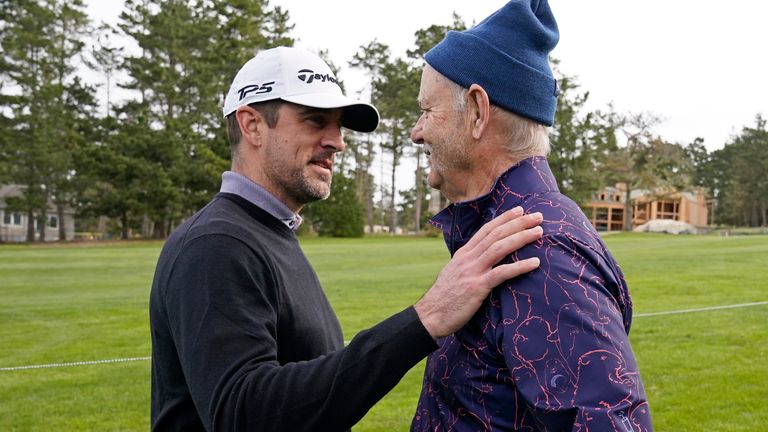 Aaron Rodgers, left, greets Bill Murray on the sixth fairway of the Spyglass Hill Golf Course during the first round of the AT&T Pebble Beach Pro-Am golf tournament in Pebble Beach, Calif., Thursday, Feb. 2, 2023. (AP Photo/Eric Risberg)