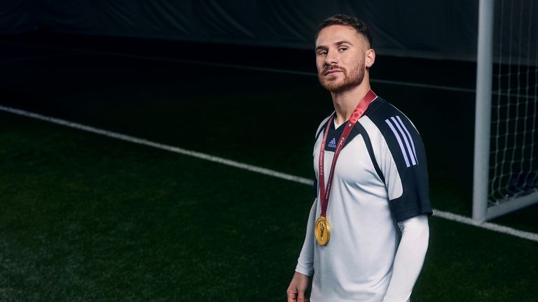 Brighton's Alexis Mac Allister with his World Cup medal for Argentina at an adidas shoot