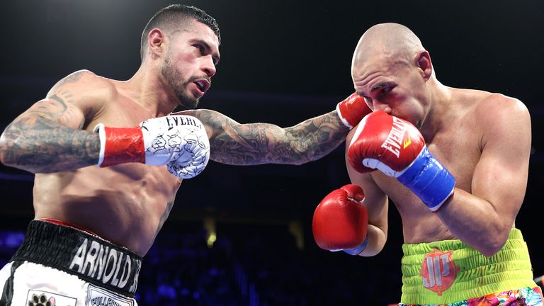 GLENDALE, ARIZONA - FEBRUARY 03: Arnold Barboza Jr (L) and Jose Pedraza (R) exchange punches during their junior welterweight bout at Desert Diamond Arena on February 03, 2033 in Glendale, Arizona.  (Photo by Mikey Williams/Top Rank Inc via Getty Images).