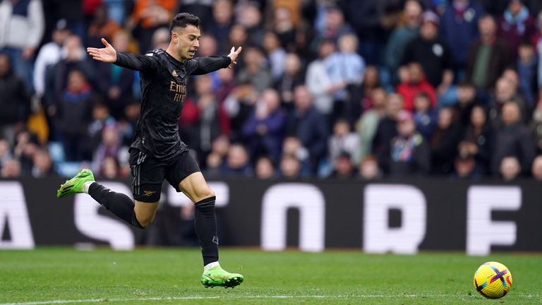 Gabriel Martinelli starts his celebration before stroking the ball into an empty net to seal Arsenal's win at Aston Villa