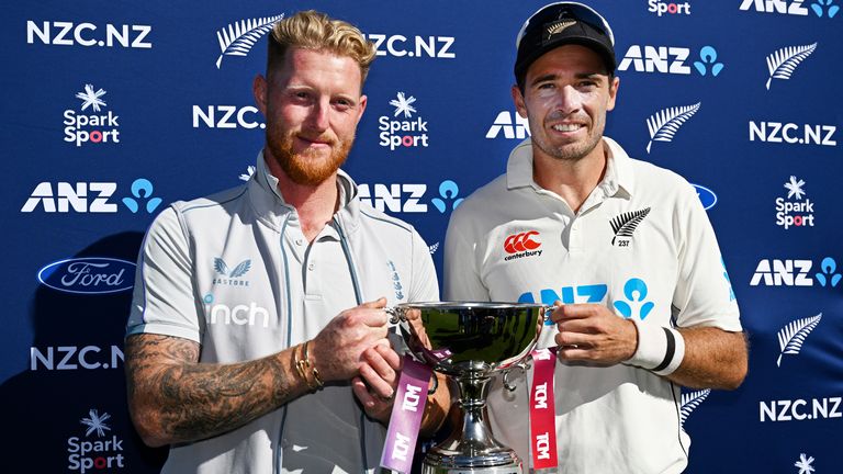 England's captain Ben Stokes, left, and his New Zealand counterpart Tim Southee share the trophy after the drawn 2-game test series after New Zealand won by 1 run on day 5 of their cricket test match in Wellington, New Zealand, Tuesday, Feb 28, 2023. (Andrew Cornaga/Photosport via AP)