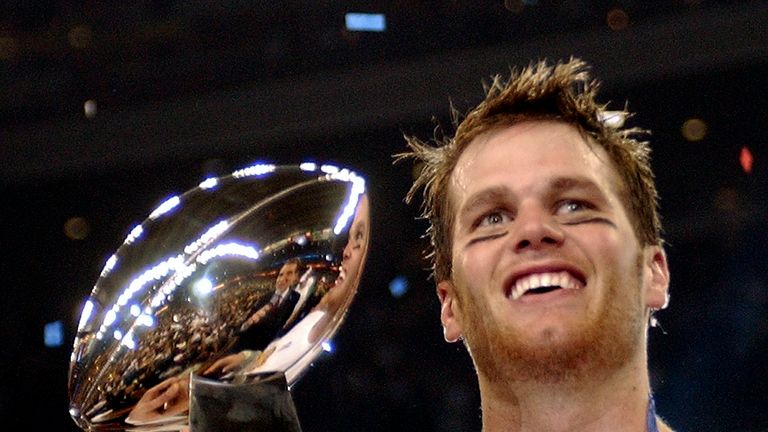 New England Patriots quarterback Tom Brady holds the Vince Lombardi Trophy after the Patriots beat the Carolina Panthers 32-29 in Super Bowl XXXVIII in Houston, Feb. 1, 2004. Tom Brady has retired after winning seven Super Bowls and setting numerous passing records in an unprecedented 22-year-career. He made the announcement, Tuesday, Feb. 1, 2022, in a long post on Instagram.