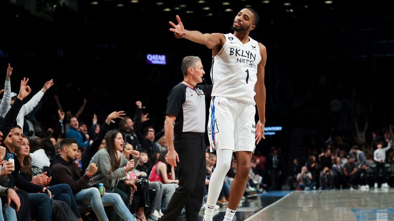 Brooklyn Nets forward Mikal Bridges gestures after making a 3-point basket against the Miami Heat during the second half of an NBA basketball game Wednesday, Feb. 15, 2023, in New York.