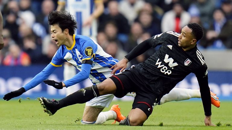 Brighton's Kaoru Mitoma is fouled by Fulham's Kenny Tete