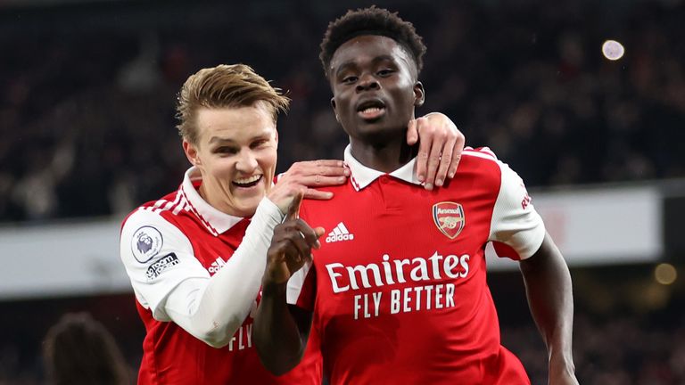 Bukayo Saka of Arsenal celebrates with Martin Odegaard after scoring vs Man City