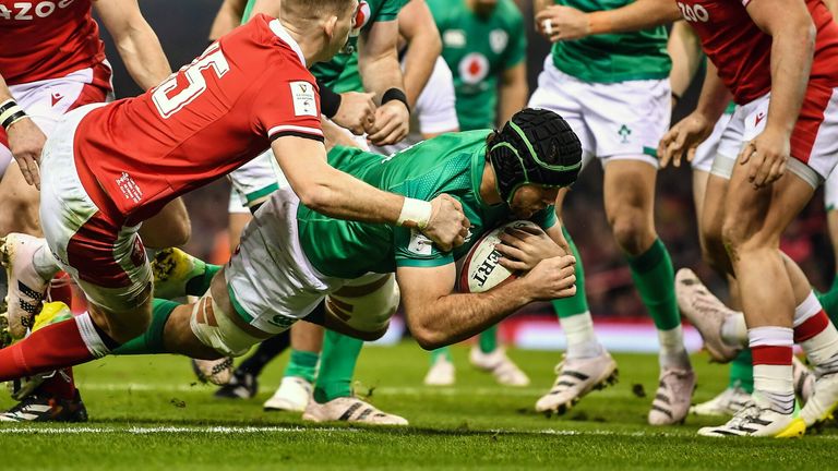 4 February 2023; Caelan Doris of Ireland scores his side's first try despite the tackle of Liam Williams of Wales during the Guinness Six Nations Rugby Championship match between Wales and Ireland at Principality Stadium in Cardiff, Wales. Photo by David Fitzgerald/Sportsfile