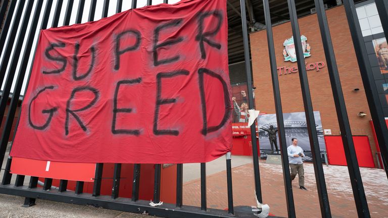 A banner is seen outside Liverpool's Anfield stadium after England's involvement in the proposed European Super League collapsed, Liverpool, England, Wednesday April 21, 2021. Liverpool owner John W Henry presented his apologies to the club's supporters for the 