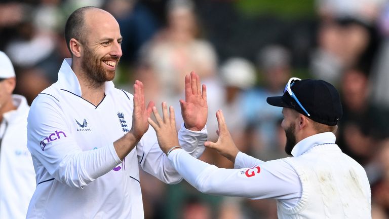 Jack Leach (left) celebrates with his England teammate Ben Duckett after bowling with New Zealand's Will Young on day three of the second England v New Zealand cricket test at the Basin Reserve in Wellington, New Zealand, Sunday February 26, 2023 (Andrew Cornaga/Photosport via AP)