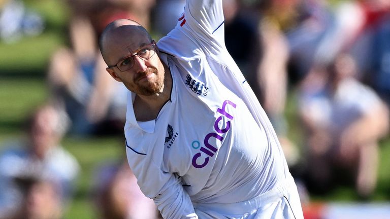 England&#39;s Jack Leach bowls to New Zealand on the second day of their cricket test match in Tauranga, New Zealand, Friday, Feb. 17, 2023. (Andrew Cornaga/Photosport via AP)