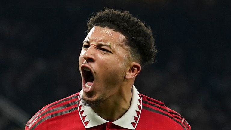 Manchester United's Jadon Sancho celebrates after scoring his sides second goal during the English Premier League soccer match between Manchester United and Leeds United at Old Trafford in Manchester, England, Wednesday, Feb. 8, 2023. (AP Photo/Dave Thompson)