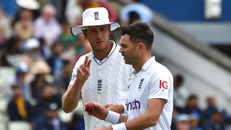 England's James Anderson, right, listens to team-mate Stuart Broad before kicking off his next delivery during day four of the fifth Test cricket match between England and India at Edgbaston in Birmingham, England on Monday 4 July 2022. (AP Photo/Rui Vieira