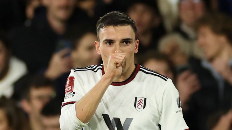 Fulham's Joao Palhinh, right, celebrates with Cedric Soares after scoring the opening goal during the English FA Cup soccer match between Fulham and Leeds United at Craven Cottage in London, Tuesday, Feb. 28, 2023. (AP Photo/Ian Walton)