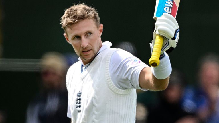 Joe Root of England gestures with his bat as he leaves the field on 153 not out as England declare on the second day of the second cricket test between England and New Zealand at the Basin Reserve in Wellington, New Zealand, Saturday, Feb. 25, 2023. (Andrew Cornaga/Photosport via AP)