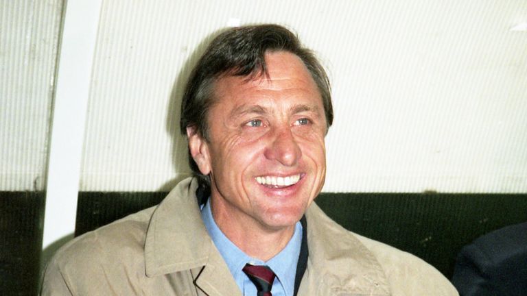 Johan Cruyff, former Dutch soccer player and manager of football club FC Barcelona, sits on March 15, 1995 on the coach's bench at the Parc Des Princes stadium in Paris, France.