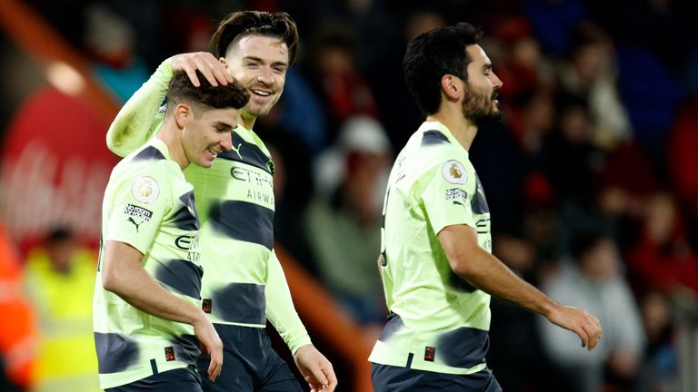 Man City goalscorer Julian Alvarez celebrates with Jack Grealish