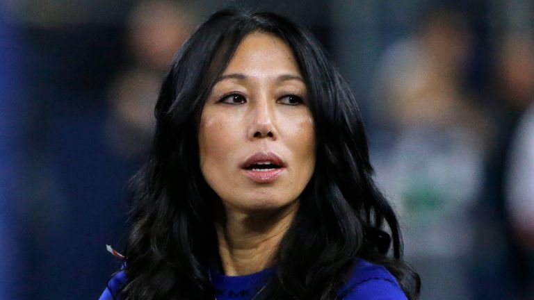 FILE - Buffalo Bills co-owner Kim Pegula stands on the field  before an NFL football game, in Arlington, Texas, on Nov. 28, 2019. Pro tennis player Jessica Pegula has revealed that her mother, Buffalo Bills and Sabres co-owner Kim Pegula, went into cardiac arrest in June and is "improving every day" as she deals with significant language and memory issues. (AP Photo/Michael Ainsworth, File)