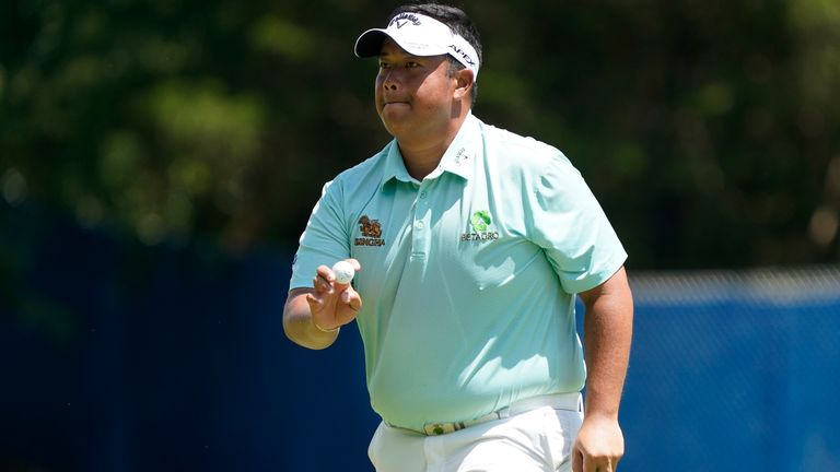 Kiradech Aphibarnrat, of Thailand, reacts after making a putt on the first hole during the final round of the Wyndham Championship golf tournament in Greensboro, N.C., Sunday, Aug. 7, 2022. (AP Photo/Chuck Burton)